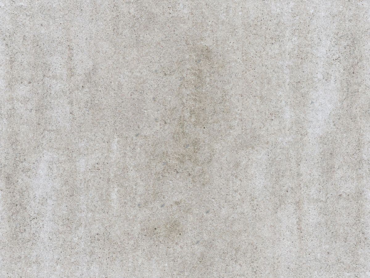 Close-up texture of a dense, freshly finished grey concrete surface.